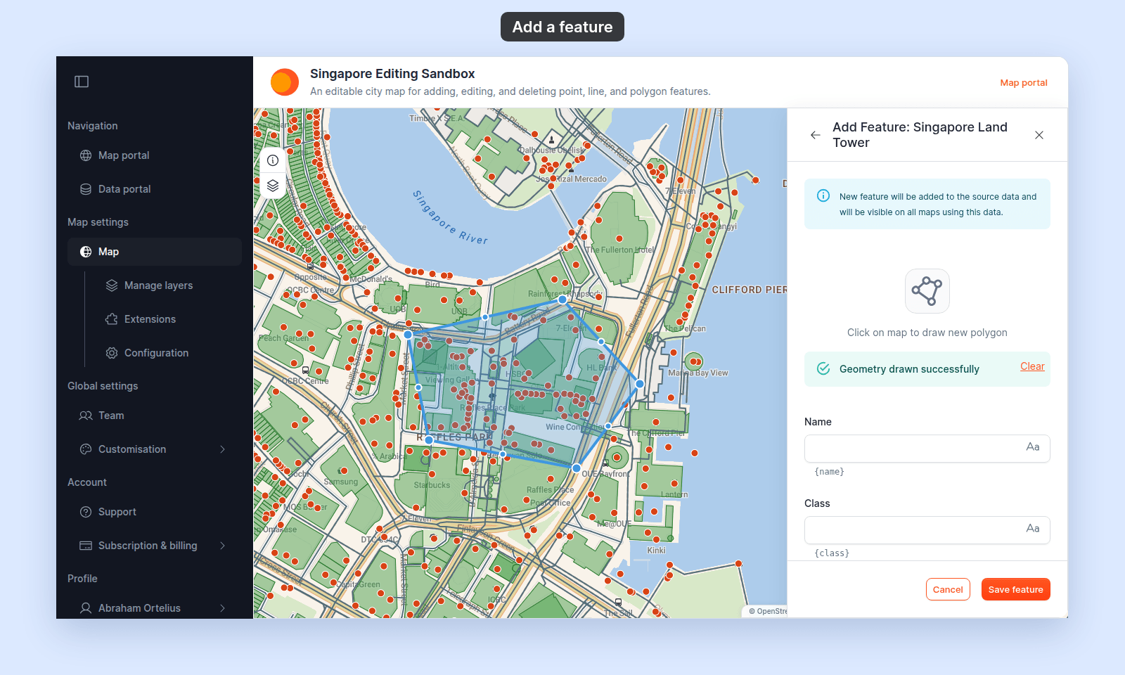 Add Feature: Singapore Land Tower panel after a new polygon was drawn on the map. The panel shows Click on map to draw new polygon, Geometry drawn successfully with a Clear link, empty Name and Class fields, and the Cancel and Save feature buttons. The new blue polygon on the map shows its corner handles